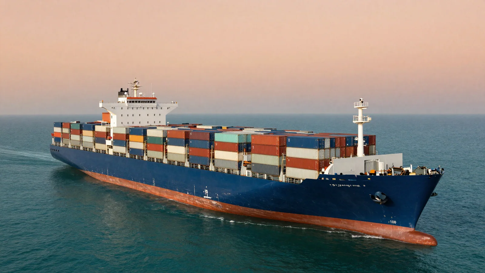 Cargo vessel crossing calm open water